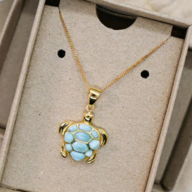 Gold necklace with a turtle pendant
