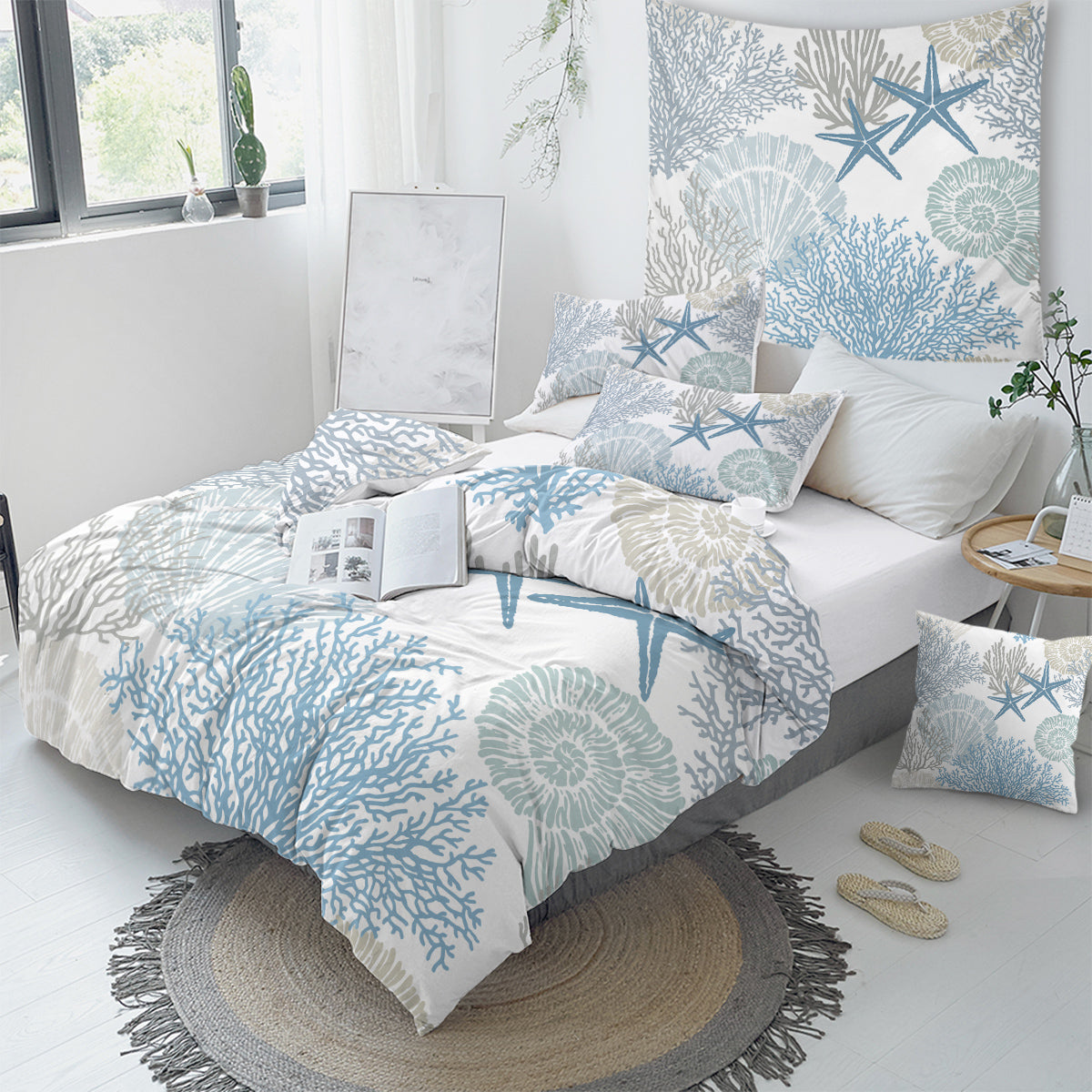 Bedroom with a bed featuring a blue and white coastal patterned comforter.
