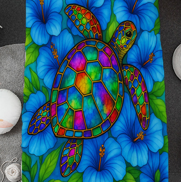 Colorful turtle and flower patterned comforter on a bed in a room setting.