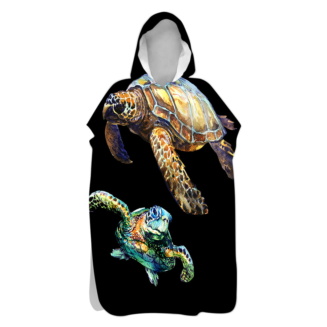 Hooded towel with turtle design on a black background