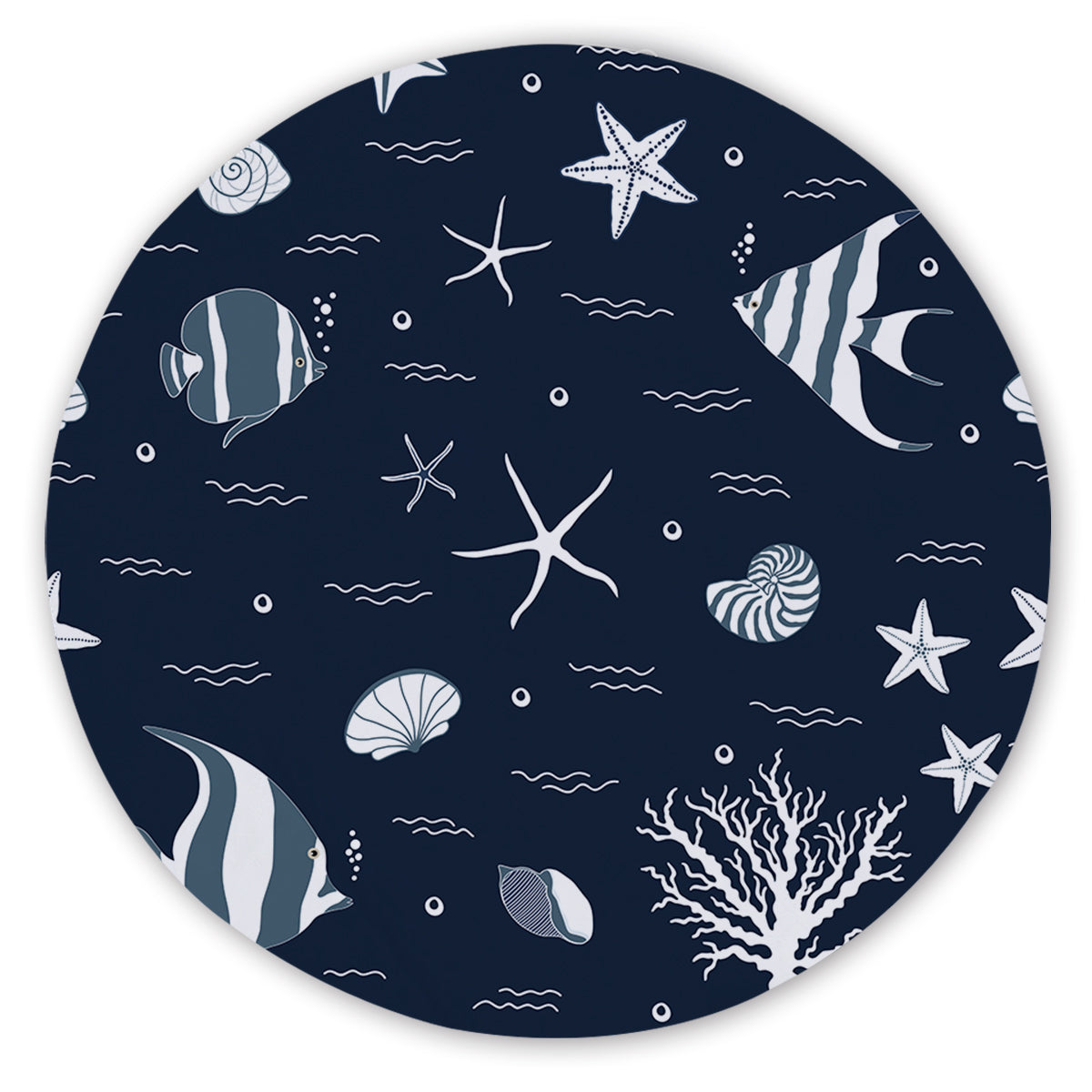 Round beach towel with nautical pattern featuring fish, stars, and shells on a dark blue background.