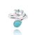 Sterling Silver Wave Ring with Swiss Blue Topaz Crests and Pear Shape Larimar